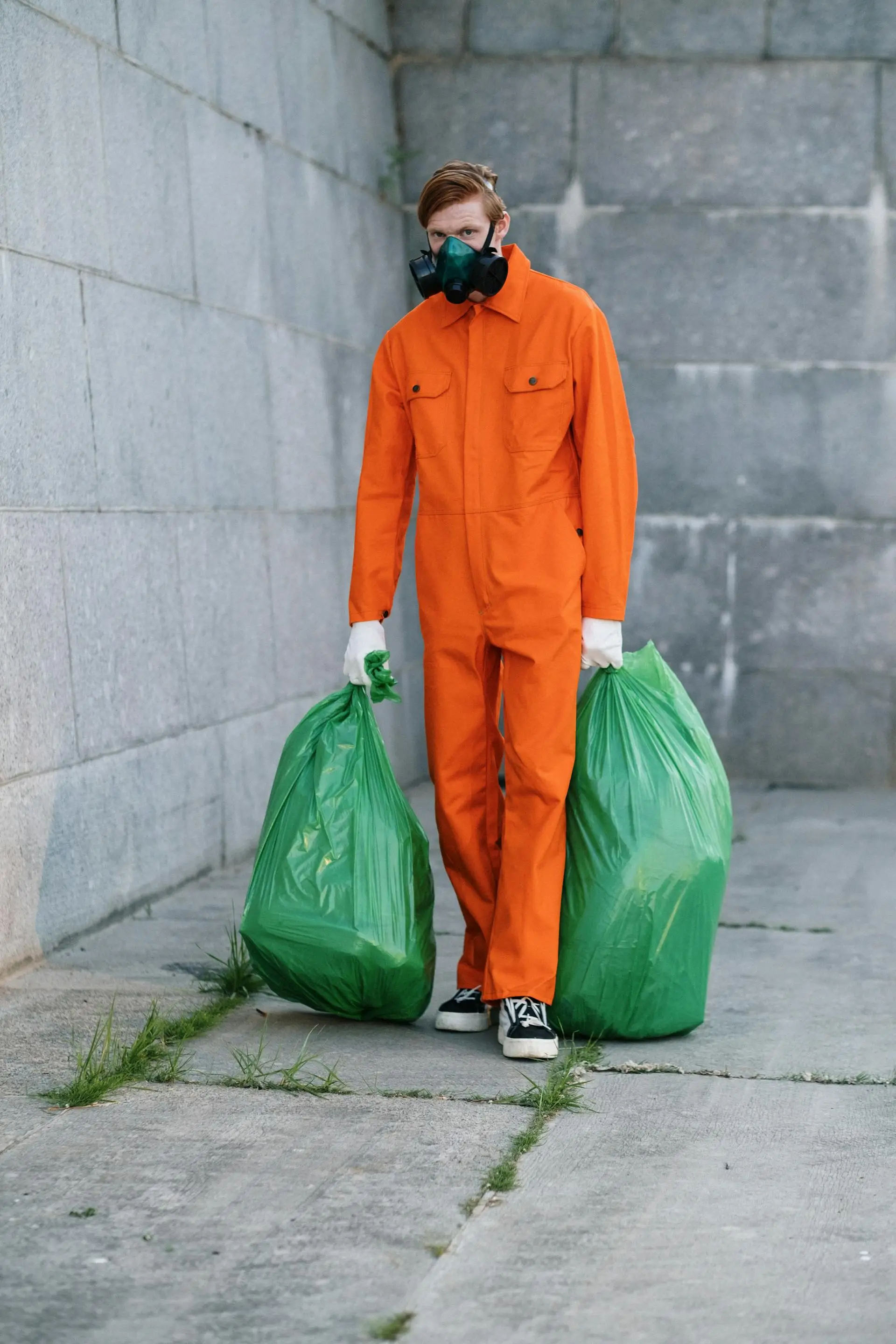 Professional sewage cleanup crew in protective equipment performing sanitation work